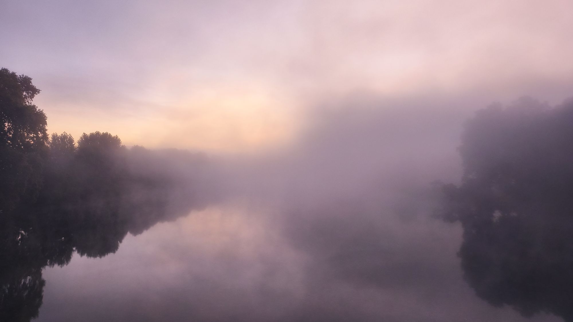 Mist over a still river at dawn, Minho